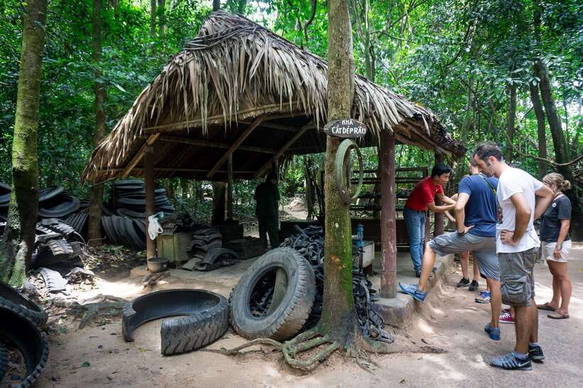 Cu Chi Tunnels Afternoon Trip from Ho Chi Minh City - Entering Cu Chi: photos, guided walking, then the real show