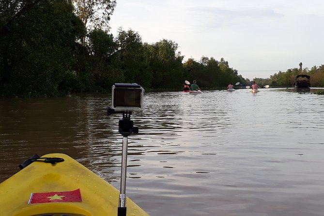 Full Day Experience Mekong River Life By Kayak & Boat. - Stop 1: Cai Be Floating Market by boat, with fruit and daily routines