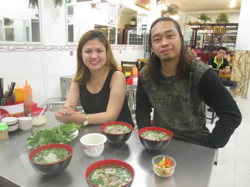 Ho Chi Minh City: Midnight Motorbike Tour - Old Mafia area street food: snacks, drinks, and local rhythm