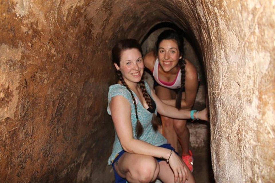 Ho Chi Minh: Discover Cu Chi Tunnels Half-Day Tour - Guerrilla Survival Tactics: Hiding Spots and Booby Traps