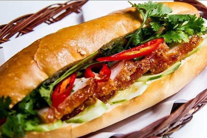 Morning Walking Food Tour in Non Tourist Area and Full of Local Life - District-Style Bites: Banh Mi Heo Quay and Banh Khot