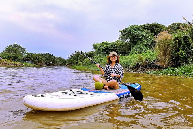 Paddling to explore the historic Vietnam War Rach Chiec jungle, - Stop 1 in Ho Chi Minh City: coconut jungle, a drink, and sunset time