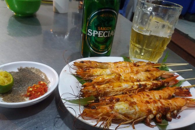 Saigon After Dark and Street Food by Motorbike and Scooter - Flower market break and the night ride through District 5, the bridge, and District 4