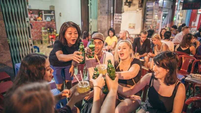 Saigon at Sunset: Ultimate Street Food Experience - Street beer with peanuts and rice crackers