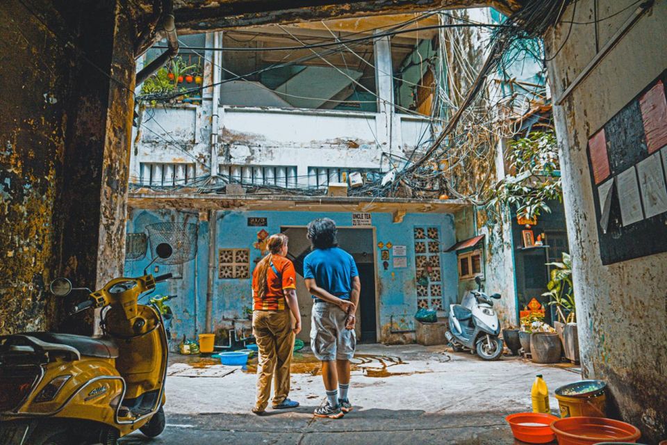 Saigon Off-the-Beaten Path-Cycling Tour in Ho Chi Minh City - Stop 1: District 4’s Saigon Reborn stories in alley-scale